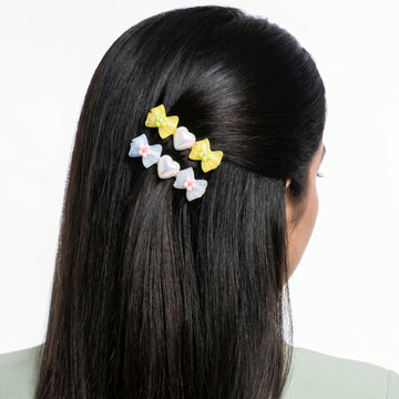 PRAO 2 Hair Clip Anti-Tarnish Yellow Pastel Blue Resin Bow Pair Flower Center Iridescent Heart Accent